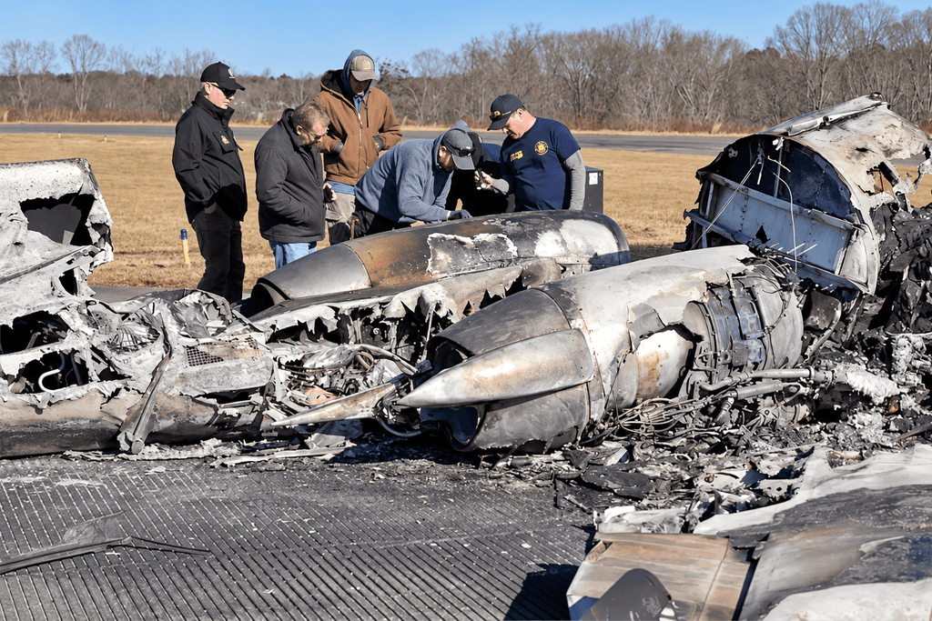 Investigators examining wreckage from the Greg Biffle Citation crash in Statesville, North Carolina.