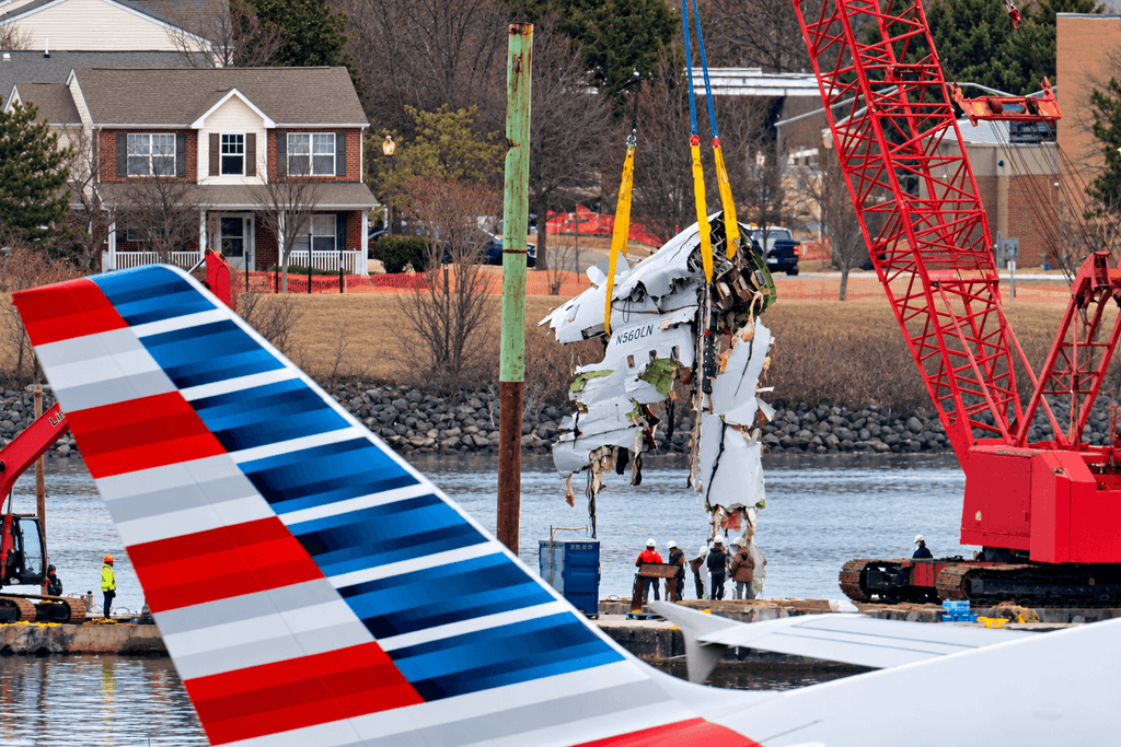 DCA midair collision investigation showing crews recovering American Airlines Flight 5342 wreckage from the Potomac River near Reagan National Airport.