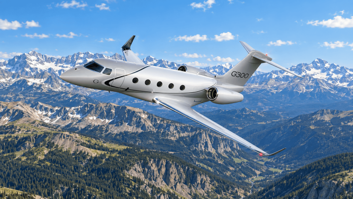 Gulfstream G300 banking above a daytime Colorado mountain landscape, featured in our Gulfstream G300 review.